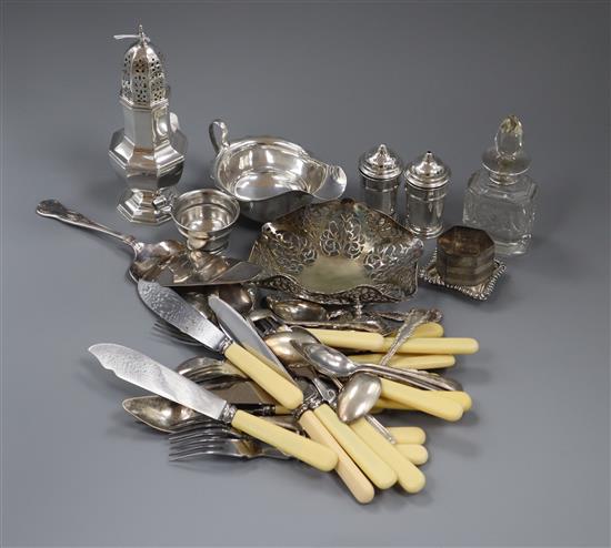 A silver sugar caster, silver sauceboat, silver condiment set, scent bottle, salt, napkin ring and assorted plated wares.